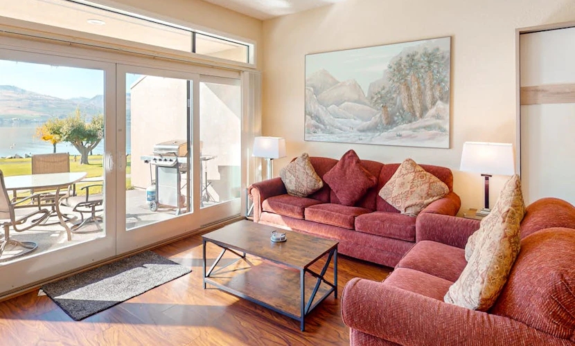 Lakefront condo with amazing views, pool, hot tub, beach access, and fireplace