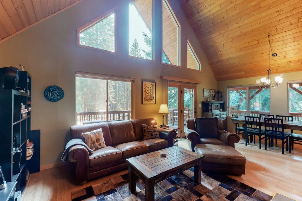 Elegant, secluded home with a wood deck, gas grill, & private hot tub