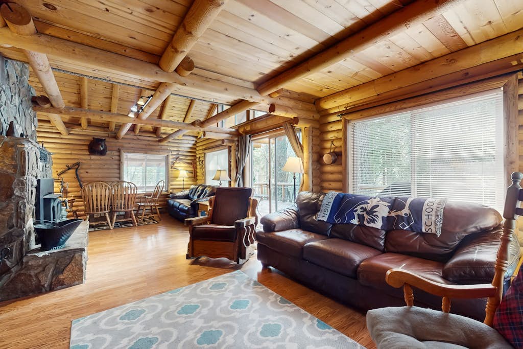 Two-story log home w/loft, lake views, wood stove, furnished deck + beach access