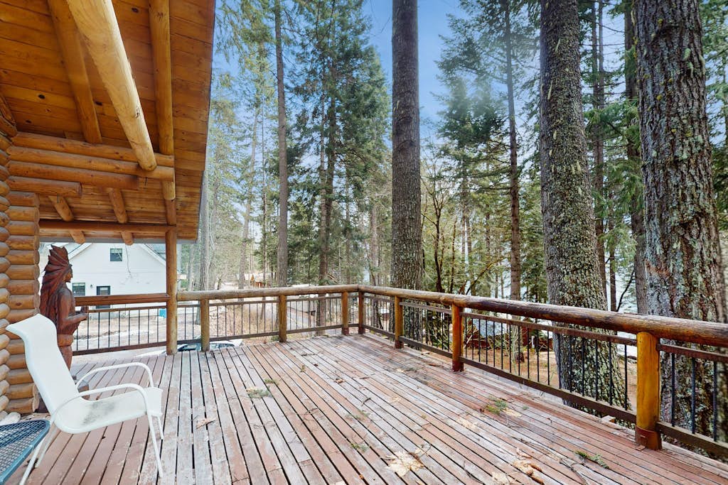 Two-story log home w/loft, lake views, wood stove, furnished deck + beach access