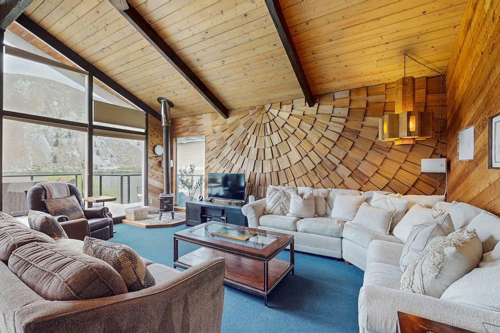 Dog-friendly waterfront home with pool, tennis courts, & large lawn