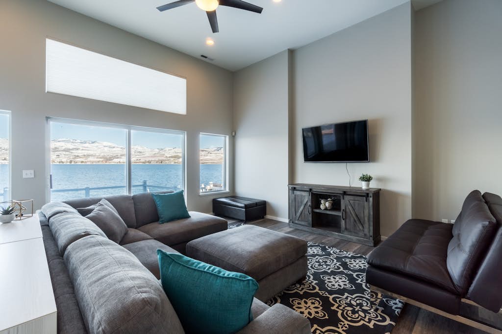 Modern lakefront home with private dock, amazing sunset views, & chef's kitchen