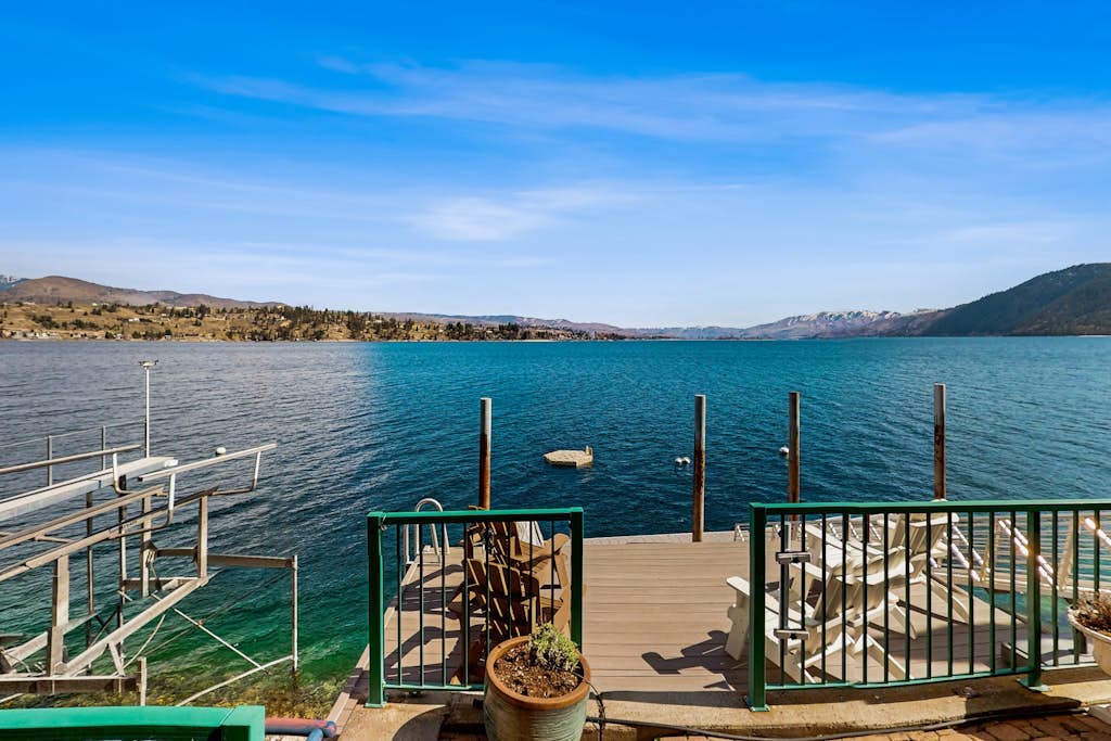 Lakefront home with private hot tub, dock, kayaks, covered veranda & huge views