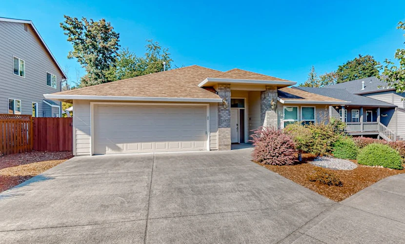 Custom-built home alongside greenspace with deck & massage chairs