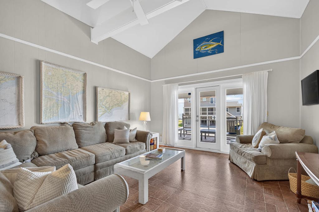 Welcome to the "Edistoneyan" Edisto Beach — Ocean Views, just steps from the sand!

4BR, 2BA | Sleeps 12

Welcome to "The Edistoneyan" your ocean-view Edisto Island getaway. Located directly across the street from the beach, this home puts the sand and surf right at your doorstep, with stunning ocean views to boot. This home is in the most ideal location on Edisto Beach, closet to restaurants, shops, grocery and recreational park activities. 

The large relaxing screened-in porch is made for slow mornings and easy evenings, complete with a dining table and rocking chairs where you can watch the world go by. Step outside to the sun deck with built-in seating—ideal for soaking up some rays or unwinding after a day at the beach. A grill is on hand for classic beach-night cookouts.

Inside, the home is thoughtfully laid out with two mirrored bedroom wings on either side of the main living space, so everyone has room to spread out. The open living, dining, and kitchen area sits right in the middle, keeping the whole group connected.

The home offers four bedrooms and two full bathrooms. On one side, you'll find a King bedroom with ocean views, along with a Queen bedroom featuring a twin bunk (2 twin beds), and a full bathroom conveniently located in the hall. On the opposite side, there's a second King bedroom with ocean views, plus another Queen bedroom with twin bunks, and a second full bathroom.

With two king bedrooms offering ocean views, this home is perfect for multiple couples or families looking to wake up to the water.

The home has a spacious open front porch off of the screened porch and an outdoor shower on the back patio. There is a laundry room downstairs with some beach gear and plenty of room for lounging and playing outdoor games. 

House Rules:

Quiet hours: 10:00 PM – 8:00 AM
Pet friendly — $150 per pet
Minimum guest age: 25