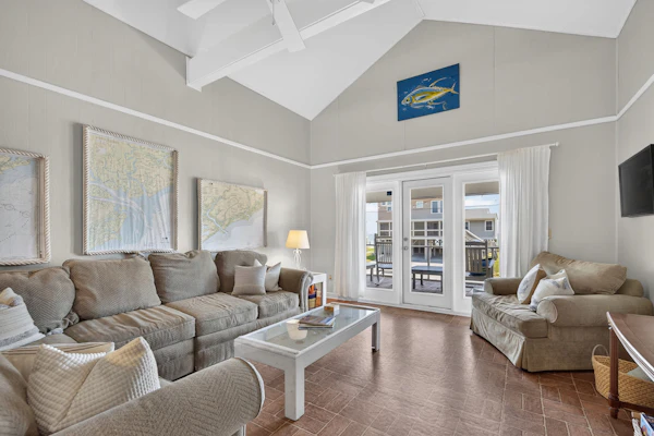 Welcome to the "Edistoneyan" Edisto Beach — Ocean Views, just steps from the sand!
4BR, 2BA | Sleeps 12
Welcome to "The Edistoneyan" your ocean-view Edisto Island getaway. Located directly across the street from the beach, this home puts the sand and surf right at your doorstep, with stunning ocean views to boot. This home is in the most ideal location on Edisto Beach, closet to restaurants, shops, grocery and recreational park activities.
The large relaxing screened-in porch is made for slow mornings and easy evenings, complete with a dining table and rocking chairs where you can watch the world go by. Step outside to the sun deck with built-in seating—ideal for soaking up some rays or unwinding after a day at the beach. A grill is on hand for classic beach-night cookouts.
Inside, the home is thoughtfully laid out with two mirrored bedroom wings on either side of the main living space, so everyone has room to spread out. The open living, dining, and kitchen area sits right in the middle, keeping the whole group connected.
The home offers four bedrooms and two full bathrooms. On one side, you'll find a King bedroom with ocean views, along with a Queen bedroom featuring a twin bunk (2 twin beds), and a full bathroom conveniently located in the hall. On the opposite side, there's a second King bedroom with ocean views, plus another Queen bedroom with twin bunks, and a second full bathroom.
With two king bedrooms offering ocean views, this home is perfect for multiple couples or families looking to wake up to the water.
The home has a spacious open front porch off of the screened porch and an outdoor shower on the back patio. There is a laundry room downstairs with some beach gear and plenty of room for lounging and playing outdoor games.
House Rules:
Quiet hours: 10:00 PM – 8:00 AM
Pet friendly — $150 per pet
Minimum guest age: 25