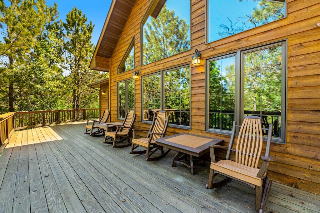 Rustic home with private hot tub, wrap-around deck, jetted tub, wood fireplace