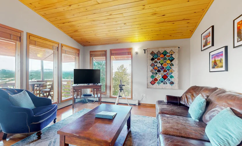 Secluded mountain-view home with expansive deck, hot tub, deck, & grill