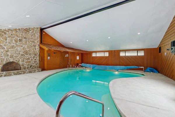 Spacious home with indoor heated pool, volley ball court, and is dog-friendly