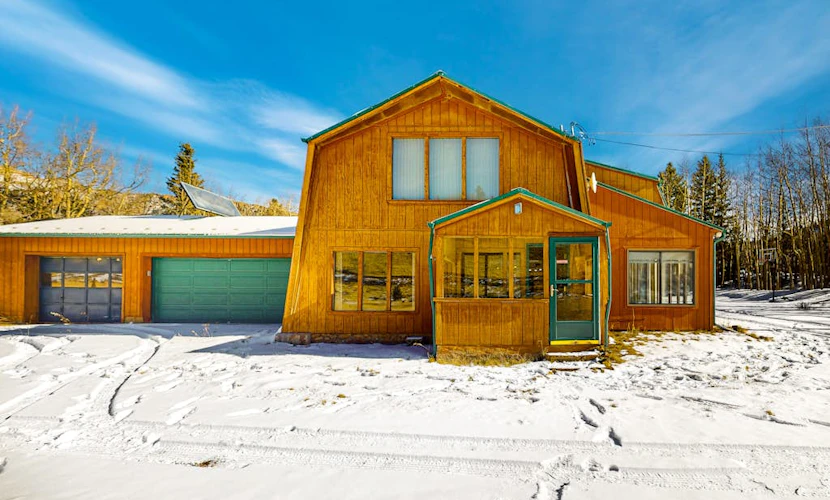 Rustic home with mountain views, wood-burning stove, basketball court, & patio