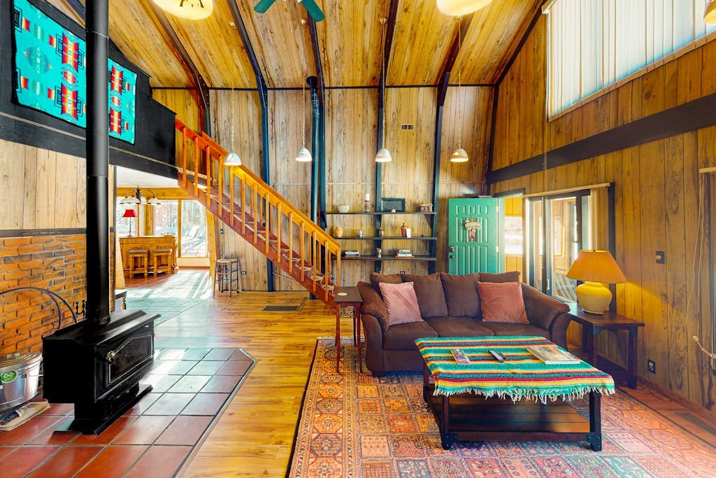 Rustic home with mountain views, wood-burning stove, basketball court, & patio