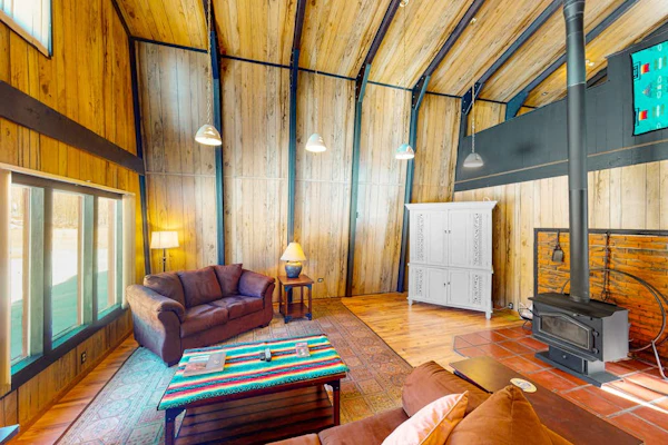 Rustic home with mountain views, wood-burning stove, basketball court, & patio