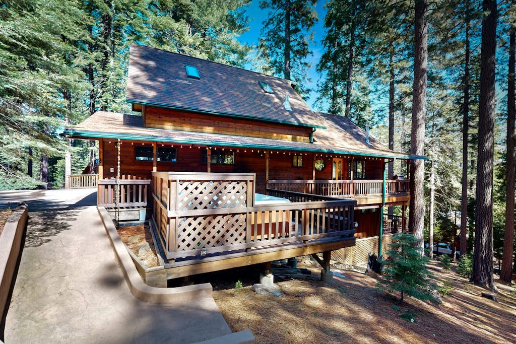 Mountain-view cabin among the trees with private hot tub, foosball, & decks
