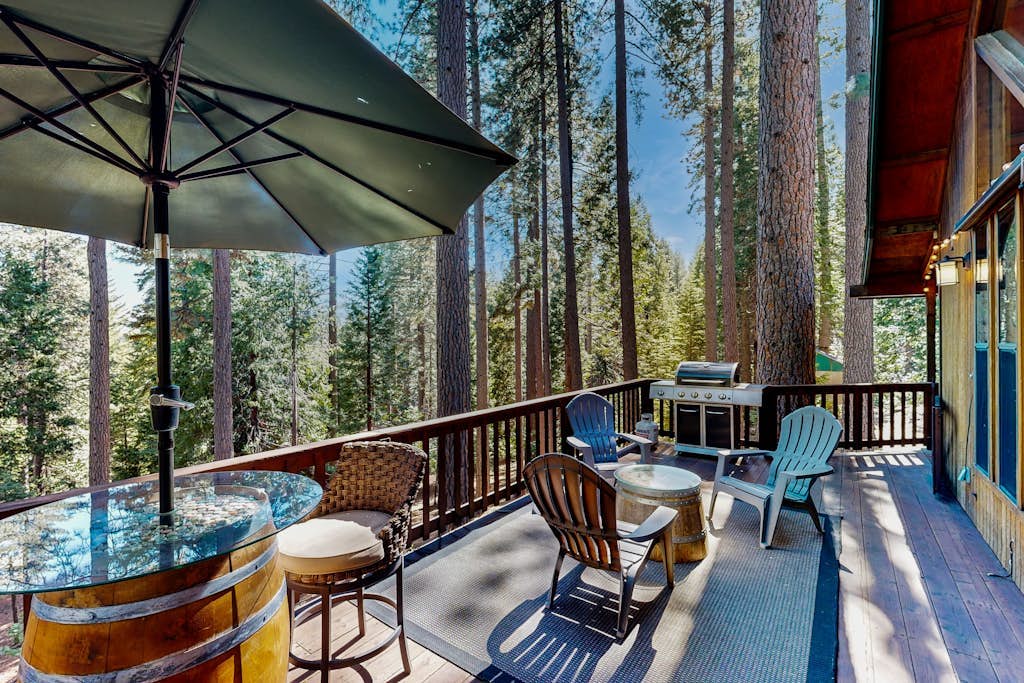 Mountain-view cabin among the trees with private hot tub, foosball, & decks