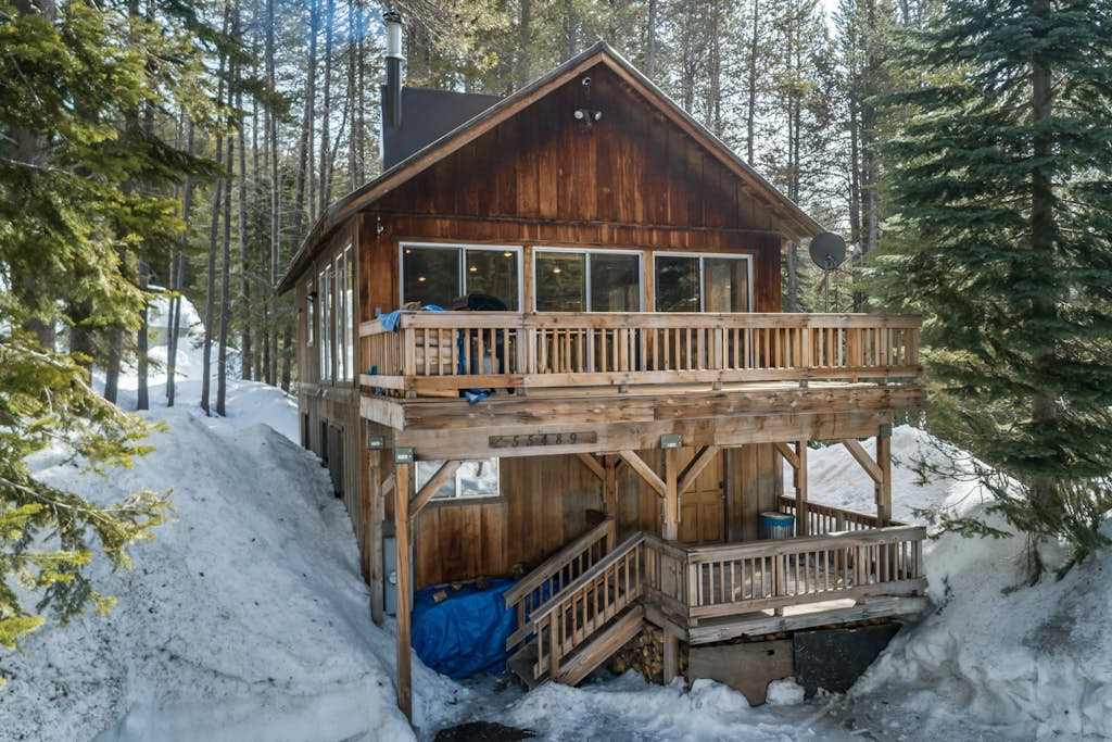 Rustic home with a wood stove, private dry sauna, & two decks with forest views