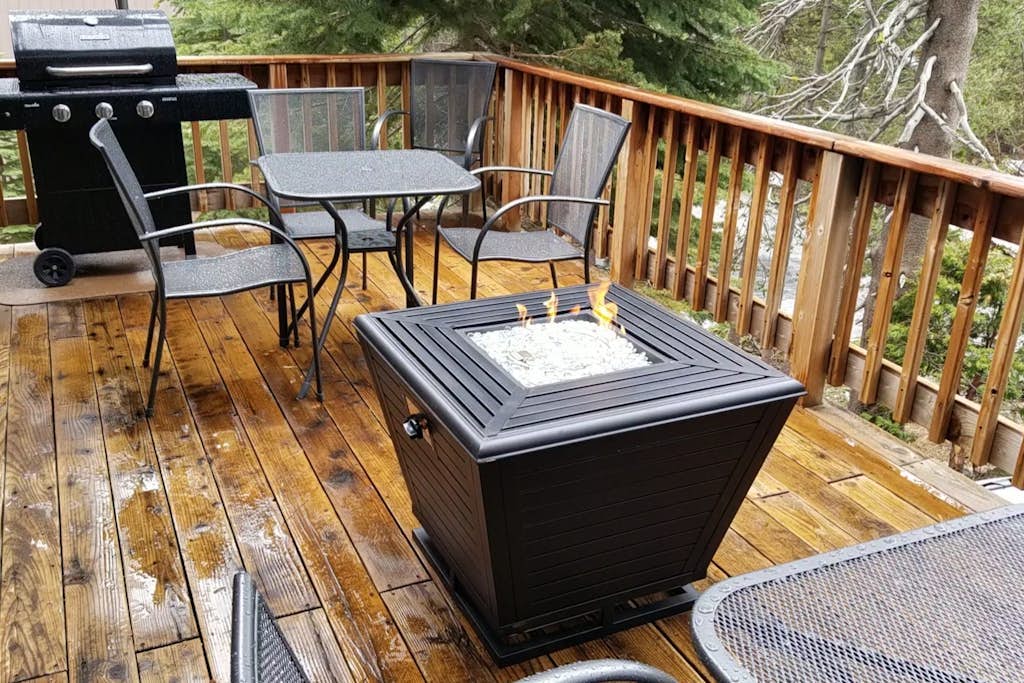 Rustic home with a wood stove, private dry sauna, & two decks with forest views