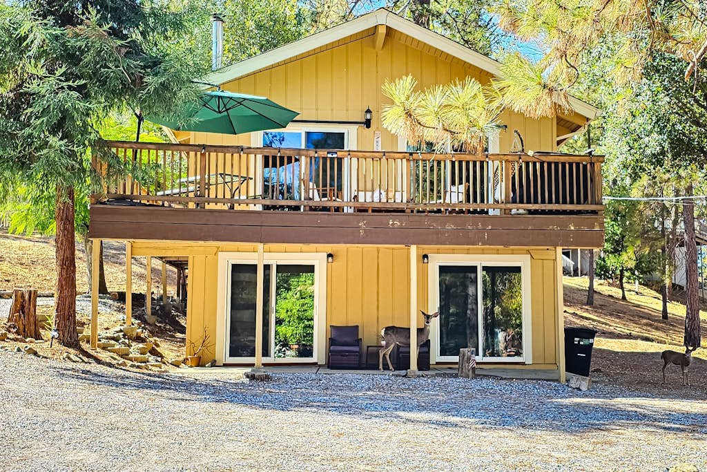 Beautiful home with wraparound deck, fireplace, and pool access
