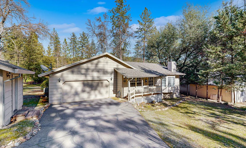 Family-friendly home with deck, stainless steel appliances, & spacious yard