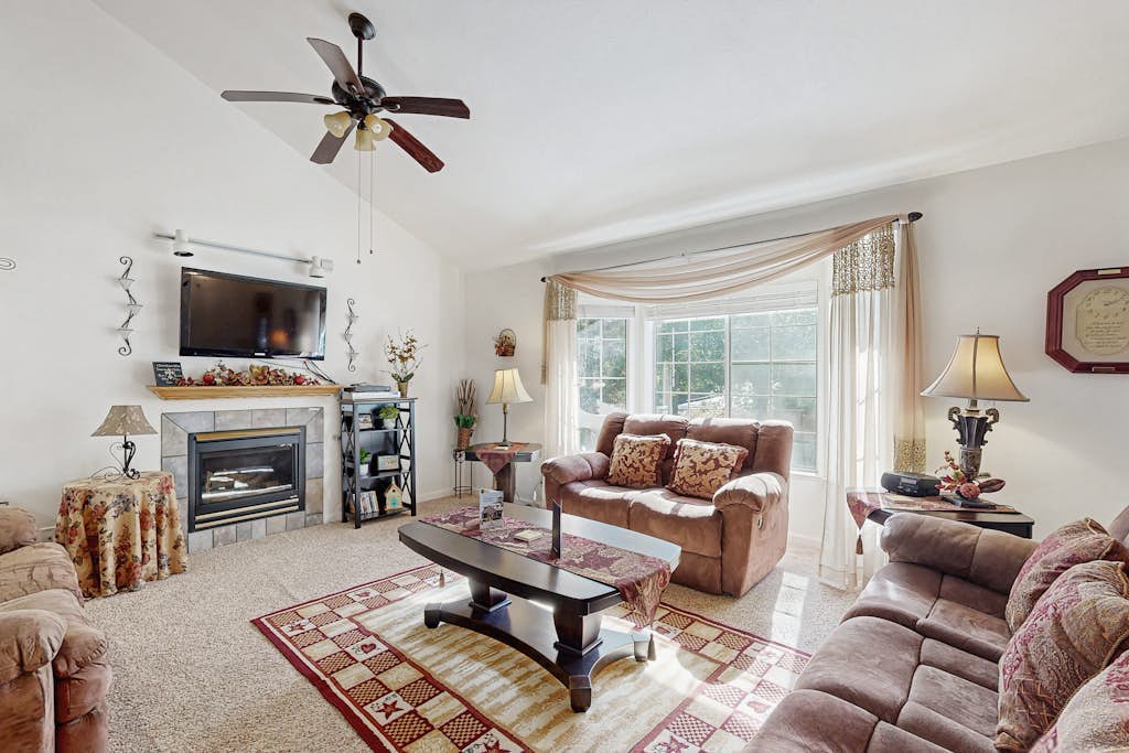 Family-friendly home with deck, stainless steel appliances, & spacious yard