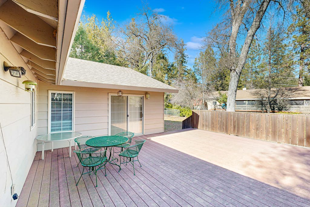 Family-friendly home with deck, stainless steel appliances, & spacious yard