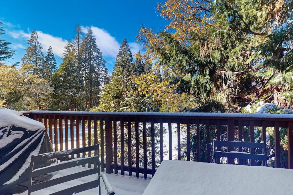 Serene cabin with deck, modern appliances, and fireplace