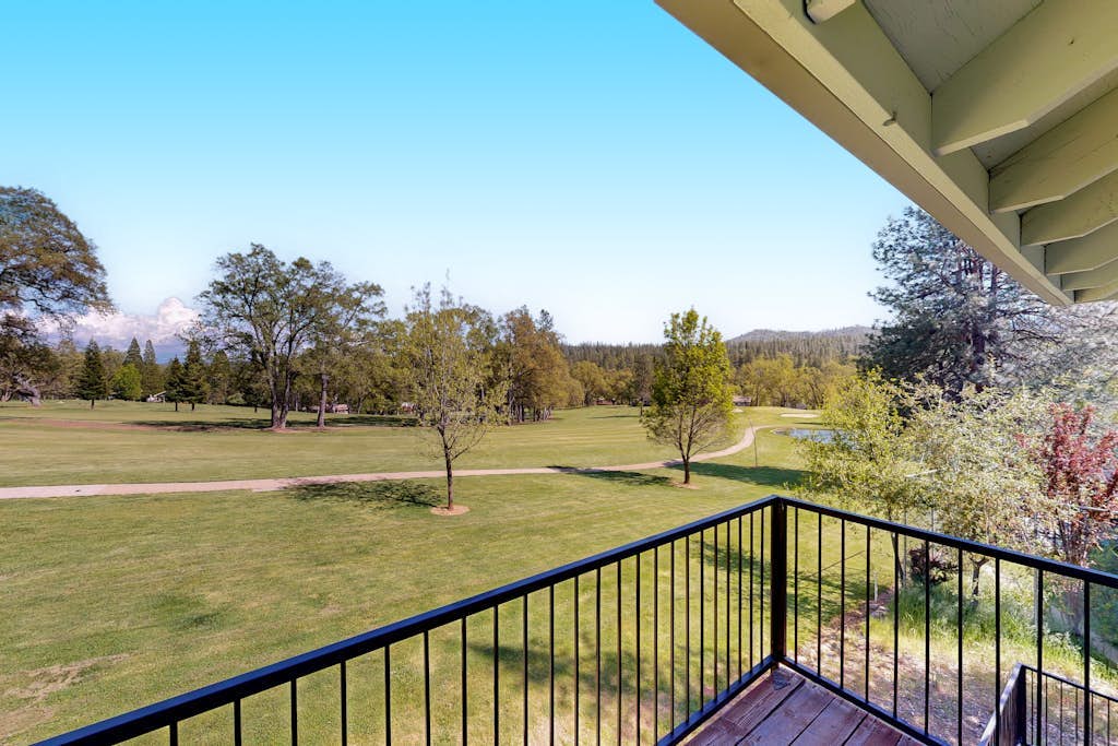 Two-story golf course-adjacent getaway with a patio, washer/dryer, central AC