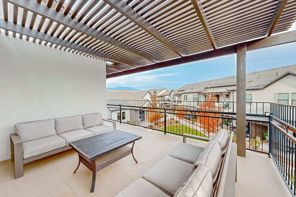Enchanting townhome with pool, hot tub, fire pit, games, & great balcony views