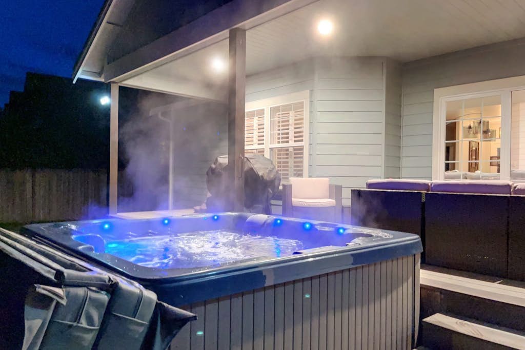 Newly built home with hot tub, fire table, game room & gym with Peloton bike