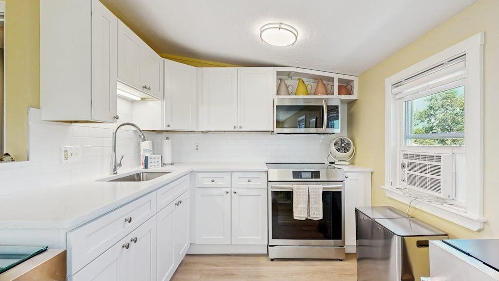 Welcome to White Dory Beach Retreat, a charming one-bedroom, one-and-a-half-bath condominium nestled in Provincetown's sought-after East End. Set within the historic White Dory, this beautifully appointed retreat offers the perfect blend of coastal charm, modern comfort, and an unbeatable location. Spend your days exploring Provincetown's vibrant shops, galleries, and restaurants before returning to your peaceful waterfront escape.

Wake each morning to beautiful bay views from your private deck, where you can sip your coffee as the sun rises over the harbor or unwind with a glass of wine after a day at the beach. Just steps across Commercial Street, the White Dory's private beach invites you to swim, kayak, paddleboard, stroll along the shoreline, or simply soak in Provincetown's spectacular sunsets. Long cherished for its private beach access and tranquil East End setting, the White Dory offers a quintessential Cape Cod experience just moments from the heart of town.

Designed for two guests, the thoughtfully furnished condo features a spacious bedroom with a queen-size bed, one full bath and an additional half bath, a fully equipped kitchen, comfortable living and dining areas, high-speed Wi-Fi, air conditioning, dedicated off-street parking, and beautifully maintained grounds. You'll also enjoy the convenience of being within walking distance of Provincetown's renowned art galleries, cafés, boutique shopping, whale watching excursions, the Pilgrim Monument, and the lively energy of Commercial Street while still enjoying the serenity of the East End.

Whether you're planning a romantic getaway, a relaxing week by the water, or a quintessential Cape Cod escape, White Dory Beach Retreat offers everything you need for an unforgettable stay—private beach access, bay views, modern comforts, and one of Provincetown's most coveted locations.