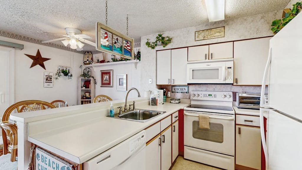 Flip-flops on, stress off—first-floor condo with pool days, patio hangs, and beach walks