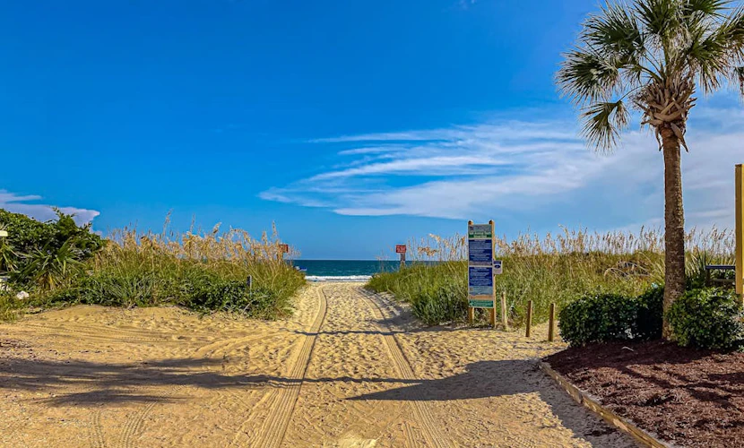 First-floor condo with patio & prime location across from Crescent Beach