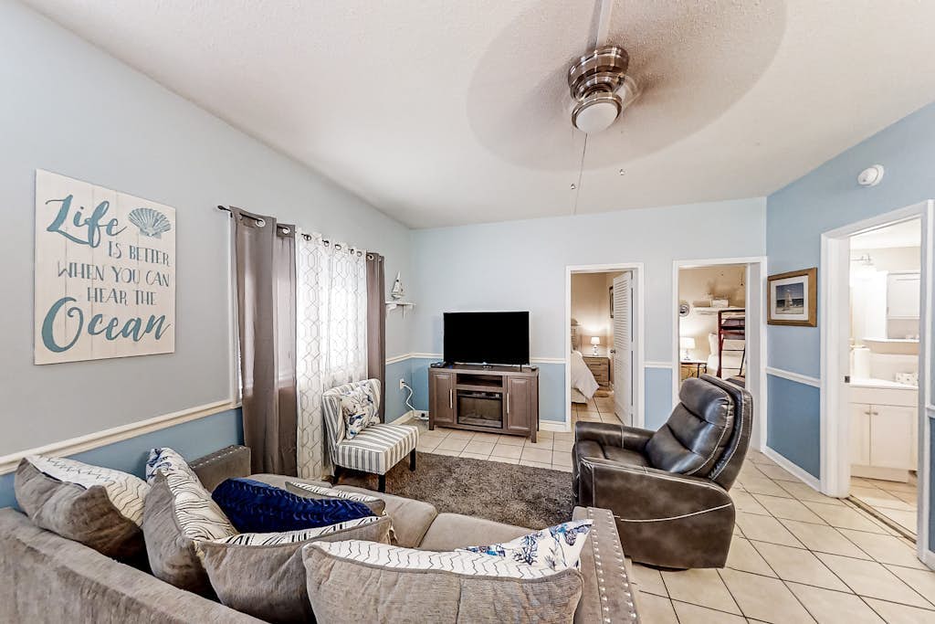 First-floor condo with patio & prime location across from Crescent Beach