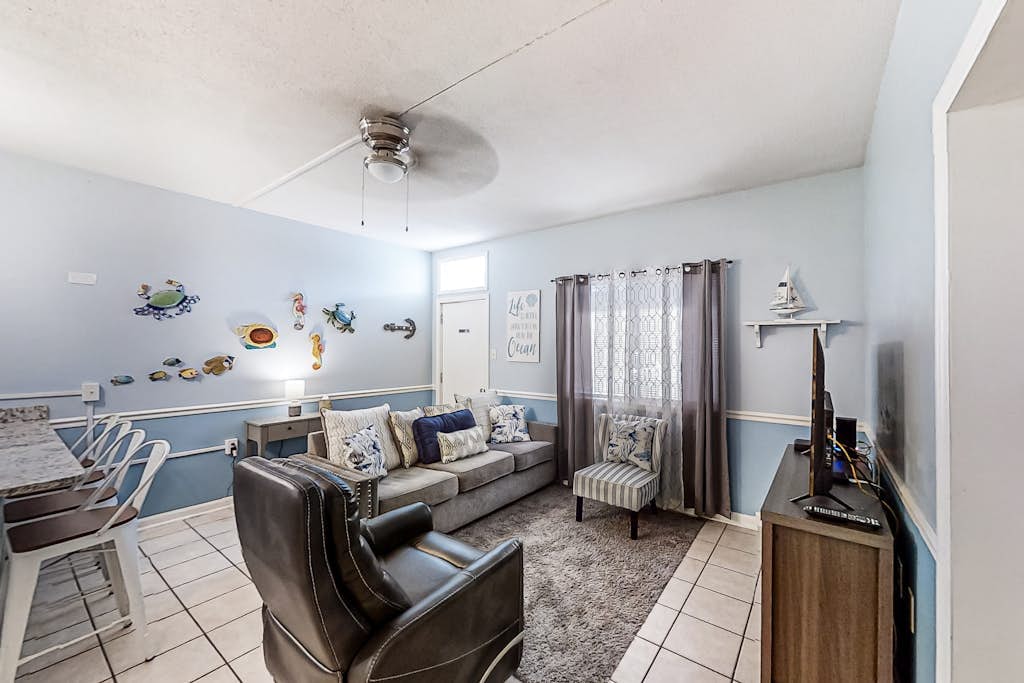 First-floor condo with patio & prime location across from Crescent Beach